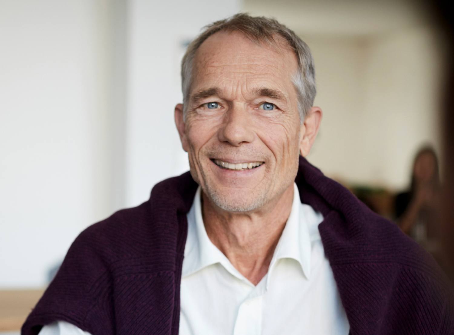 Old white man smiling.