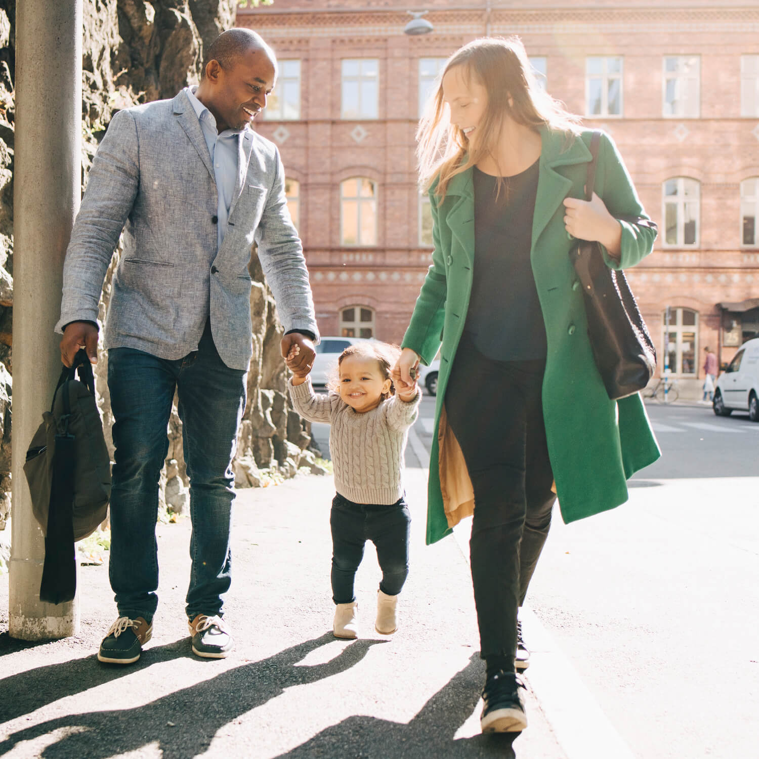 Family walking with their toddler.